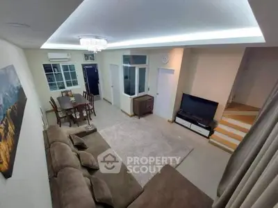 Spacious living room with modern decor and cozy seating area