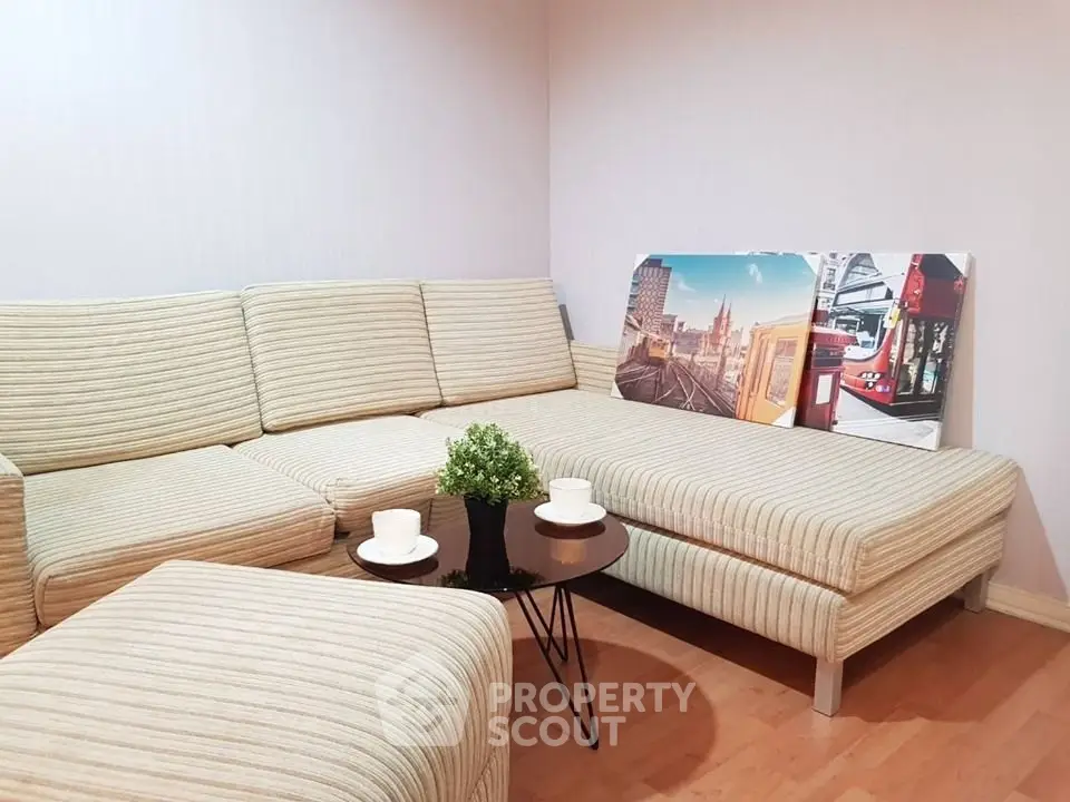 Cozy living room with striped sofa and modern decor