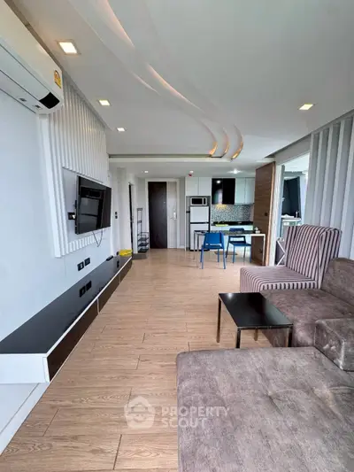 Modern living room with stylish furniture and open kitchen layout