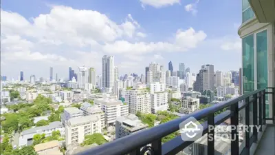 Stunning cityscape view from a modern balcony in a high-rise apartment, perfect for urban living.