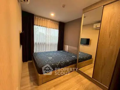 Cozy bedroom with mirrored wardrobe and stylish decor