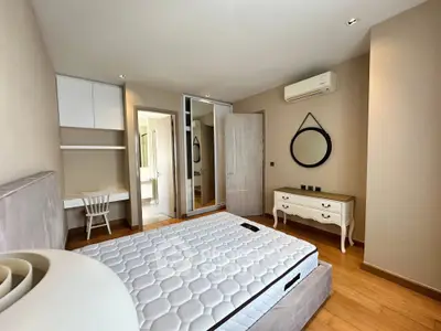 Modern bedroom with stylish furniture and natural light