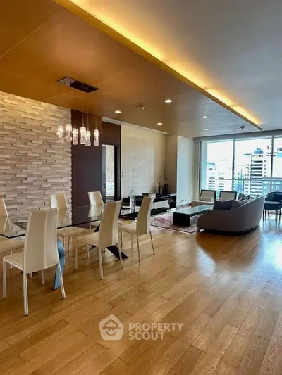Spacious modern living room with elegant dining area and city view, featuring wooden flooring and stylish lighting.
