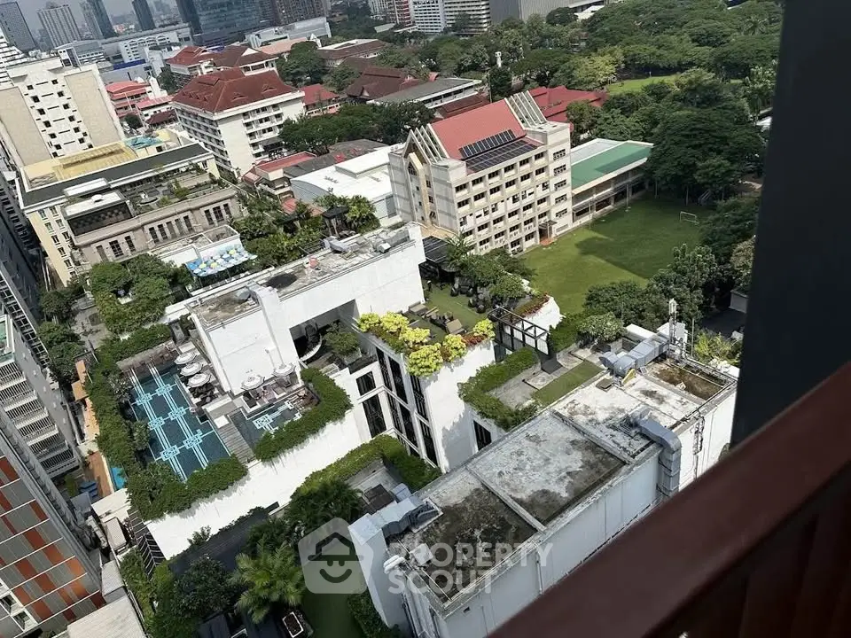 Stunning aerial view of urban landscape with lush greenery and modern architecture, perfect for city living.