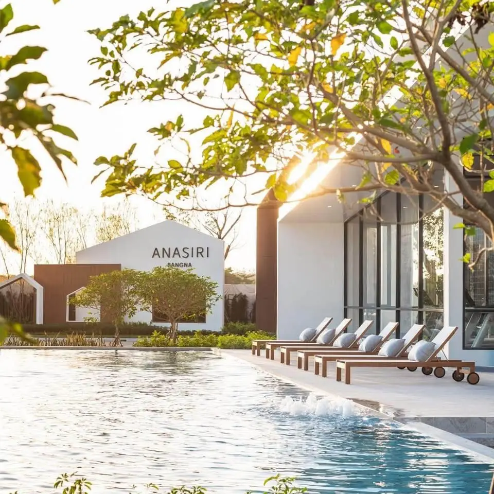 Luxurious poolside view at Anasiri, showcasing modern architecture and serene outdoor ambiance.