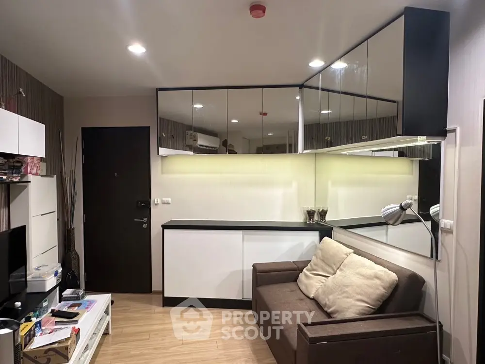 Modern living room with sleek design and ample storage space