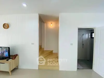 Modern interior with wooden staircase and minimalist decor