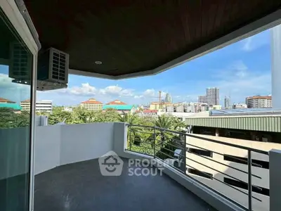 Spacious balcony with stunning city view and modern design.