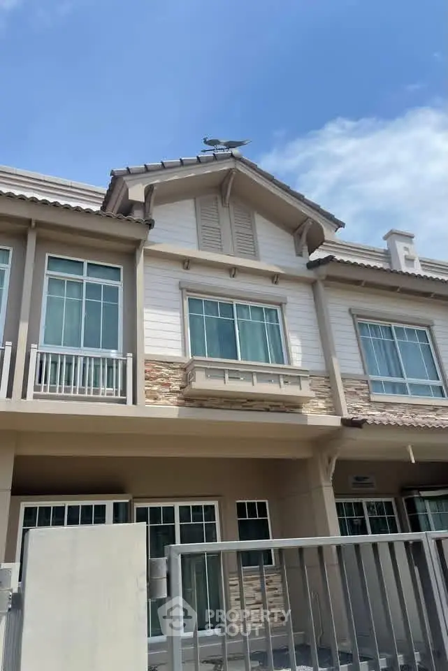 Charming townhouse exterior with modern design and large windows