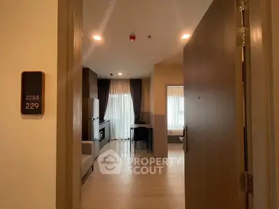 Modern apartment entrance with open view to living area and natural light