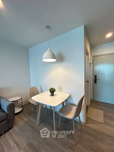Modern apartment interior with cozy dining area and stylish lighting