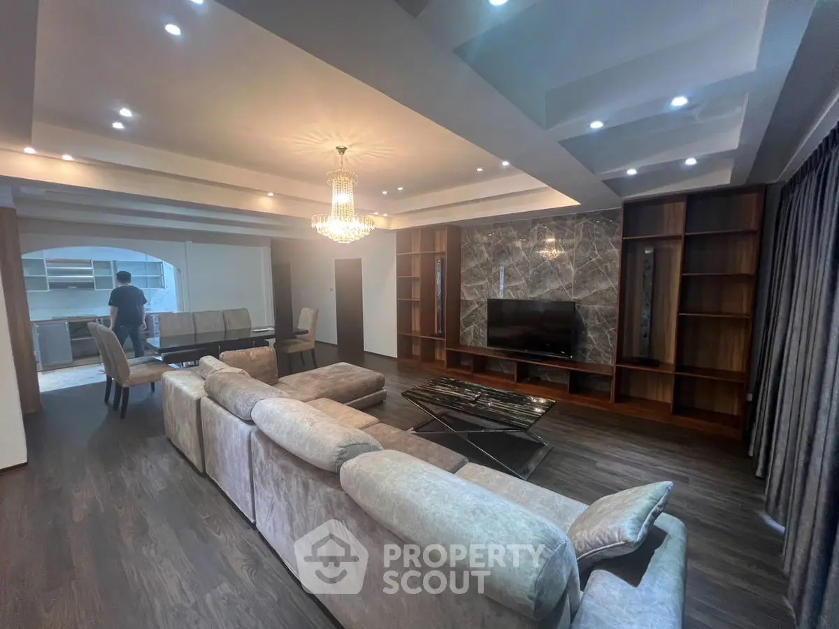 Luxurious living room with elegant chandelier and modern decor