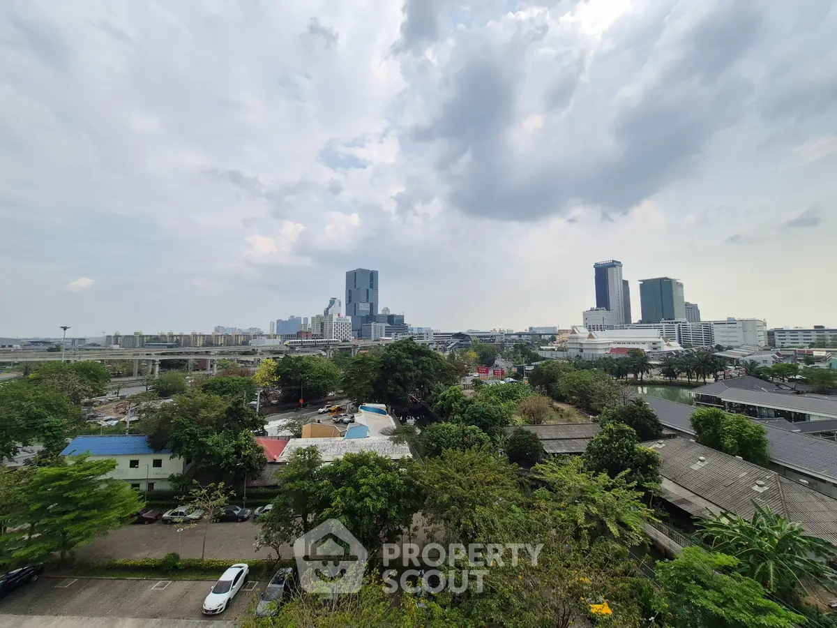 Stunning cityscape view with lush greenery and modern skyscrapers, perfect for urban living enthusiasts.
