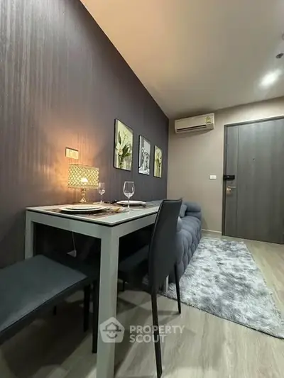 Modern dining area with stylish decor and cozy ambiance in a contemporary apartment.