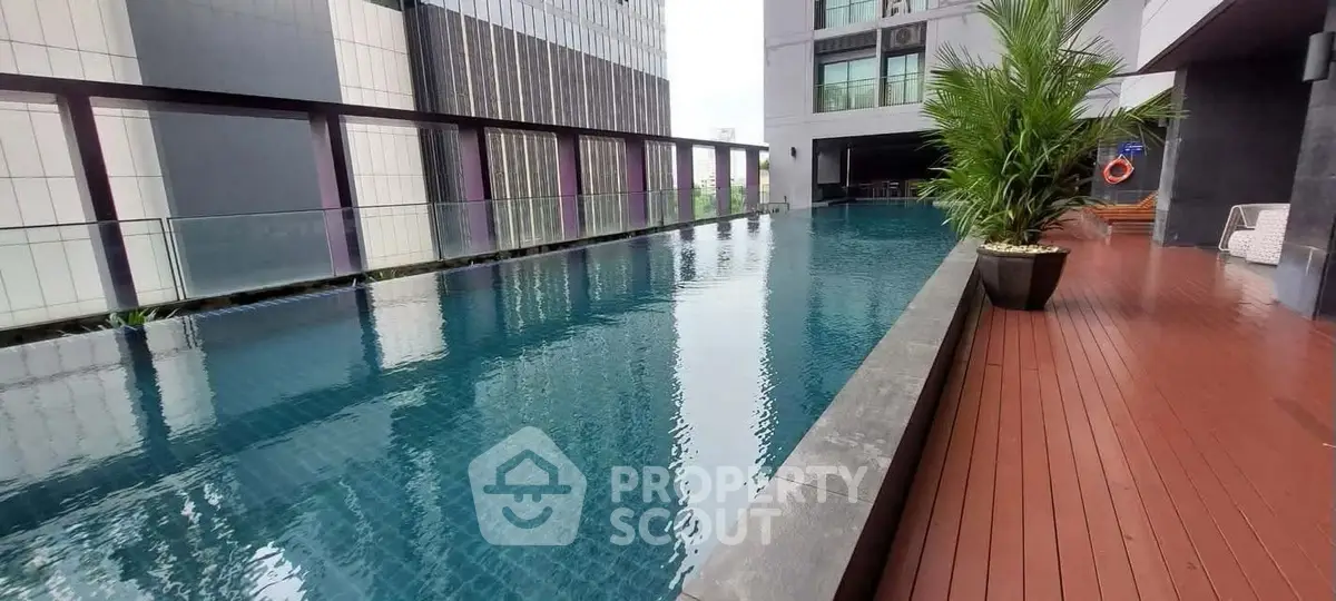 Luxurious rooftop pool with modern design and city views, perfect for relaxation and leisure.