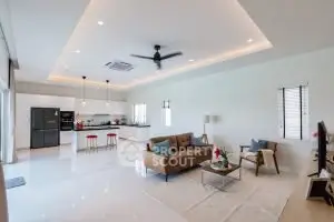 Spacious modern living room with open kitchen and stylish decor