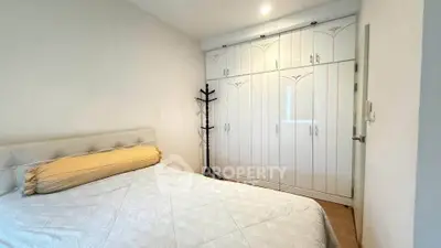 Cozy bedroom with built-in wardrobe and elegant decor