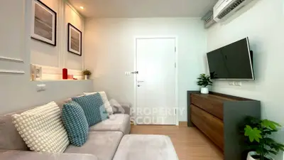 Modern living room with stylish decor and wall-mounted TV