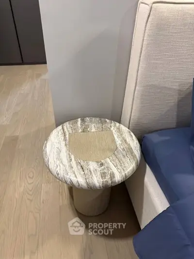 Elegant modern side table beside a plush sofa in a stylish living room