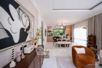 Spacious modern living room with stylish decor and open layout, perfect for entertaining.