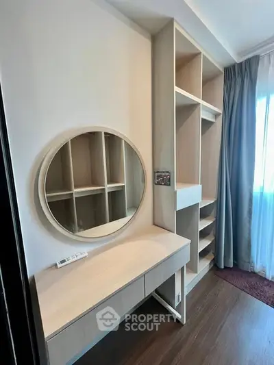 Modern bedroom with stylish vanity and ample storage space