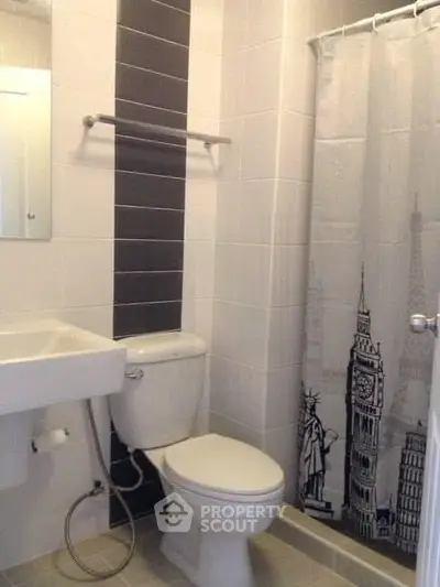 Modern bathroom with sleek design and stylish shower curtain featuring iconic landmarks.