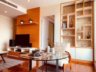 Stylish living room with modern decor and elegant shelving in a cozy apartment.