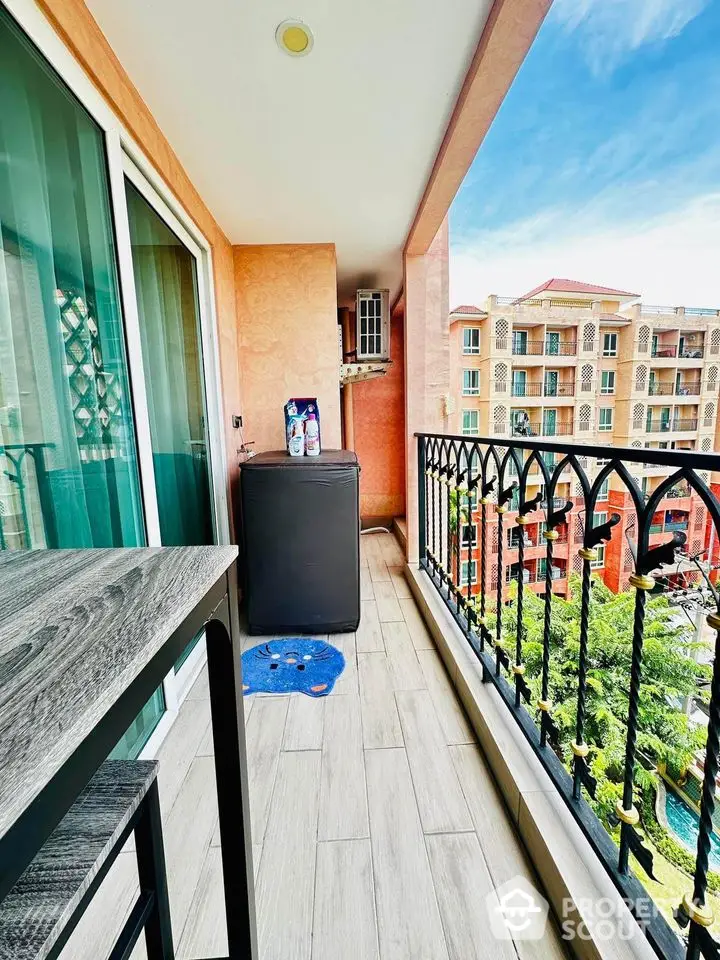 Charming balcony with elegant railing and scenic view of residential complex