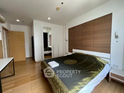 Spacious bedroom with elegant wooden accents and modern design