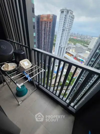 High-rise balcony with cityscape view, perfect for urban living enthusiasts.