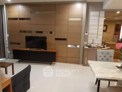 Modern living room with sleek wooden paneling and stylish furniture