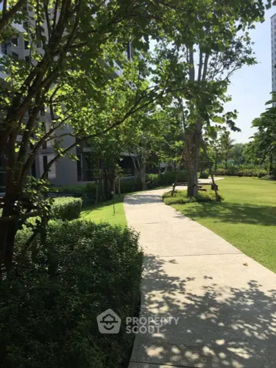 Serene garden pathway in modern residential complex