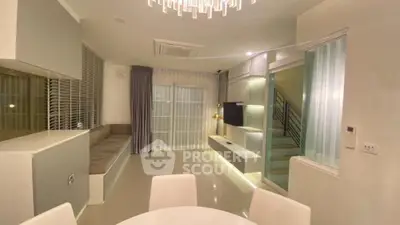 Modern living room with sleek design and ambient lighting