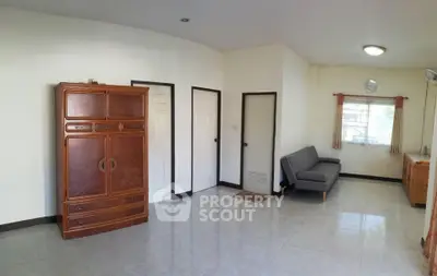 Spacious living room with minimalist furniture and natural light