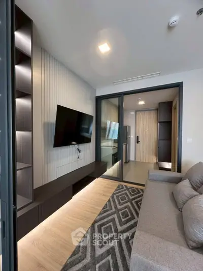 Modern living room with sleek design and wall-mounted TV