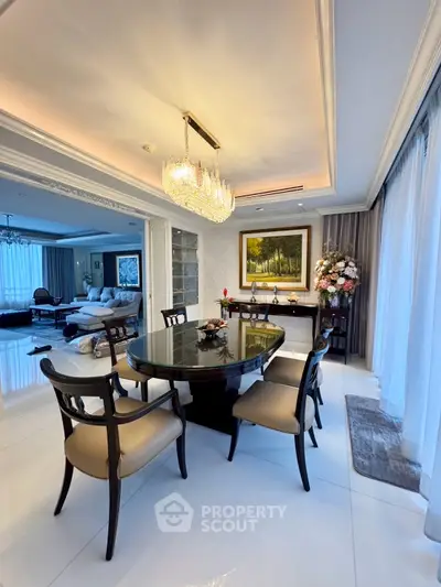 Luxurious dining room with elegant chandelier and stylish decor