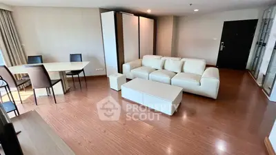 Spacious modern living room with elegant furniture and wooden flooring