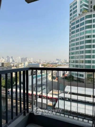 Stunning cityscape view from a modern balcony in a high-rise building.