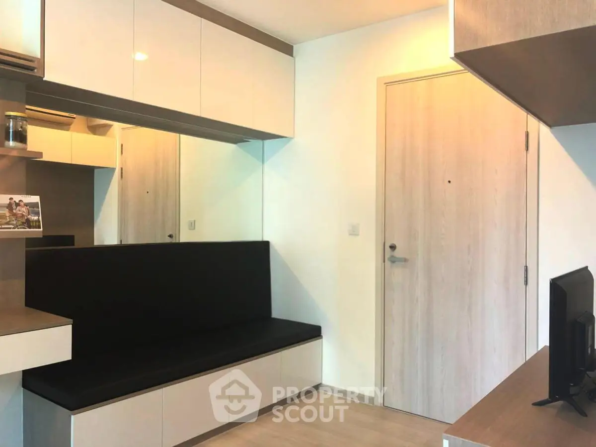 Modern living room with sleek built-in furniture and minimalist design