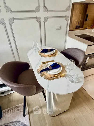 Stylish modern kitchen with elegant dining setup and chic decor