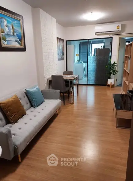 Modern living room with stylish decor and open layout in a cozy apartment.