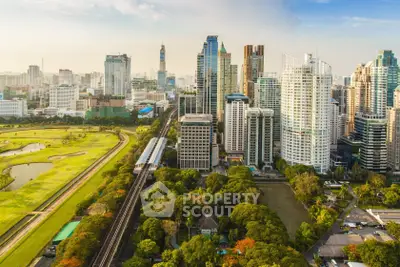 Stunning cityscape view showcasing modern skyscrapers and lush green park, ideal for urban living enthusiasts.