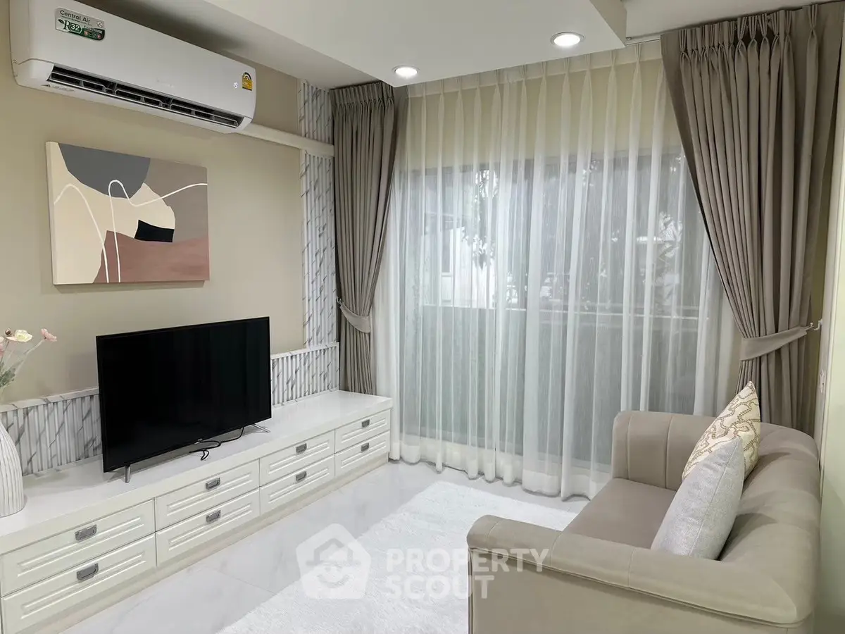 Elegant living room with modern decor and natural light