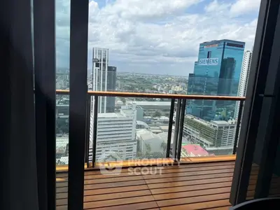 Stunning cityscape view from a high-rise balcony with sleek wooden flooring.