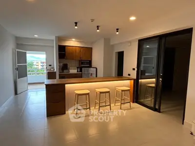 Modern kitchen with open layout and stylish island in a spacious apartment