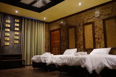 Luxurious twin bedroom with elegant decor and ambient lighting