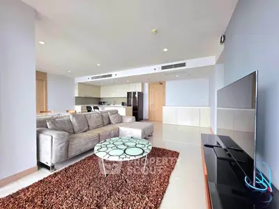Spacious modern living room with open kitchen and stylish decor