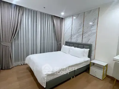 Luxurious bedroom with elegant curtains and modern design in prime real estate location.