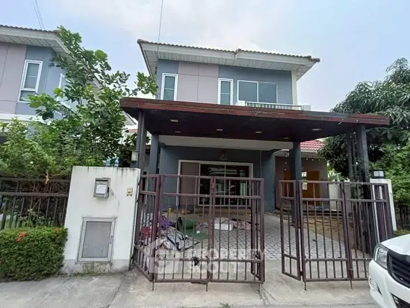 Charming two-story house with a spacious front yard and modern design.