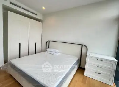 Modern bedroom with sleek wardrobe and minimalist design